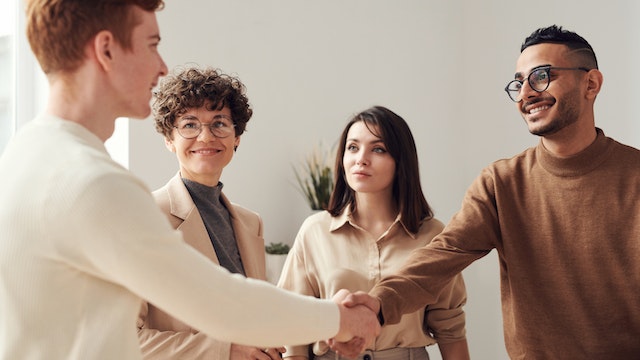 people meeting and shaking hands